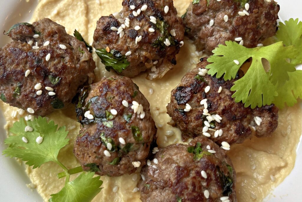 A plate of meatballs topped
